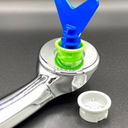 silver shower head with a blue Y-shaped tool attached on a gray background